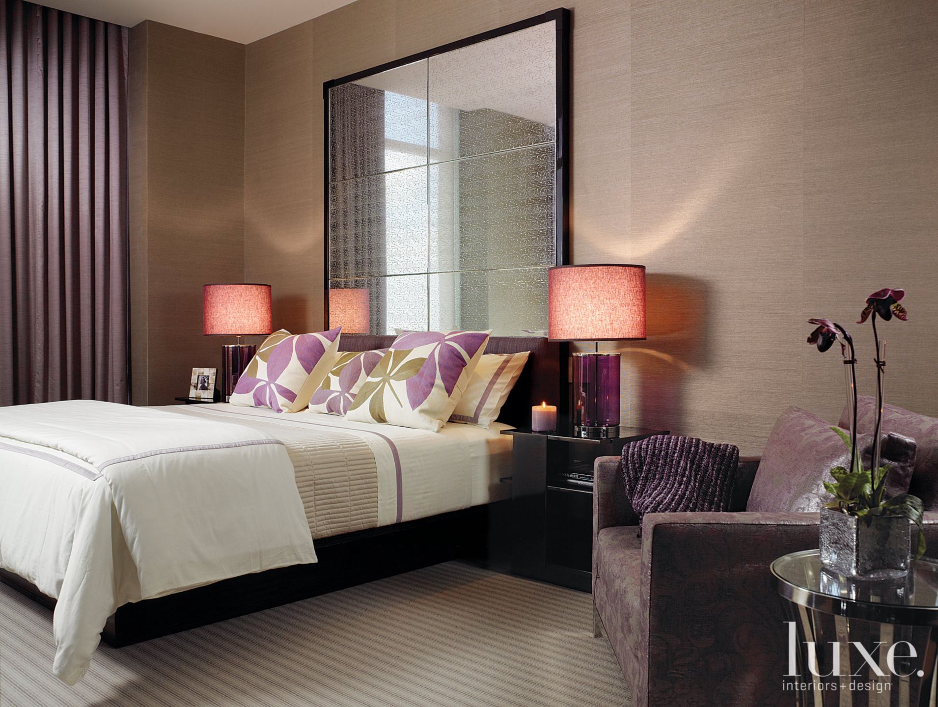 Guest bedroom with mirrored headboard Luxe Interiors + Design