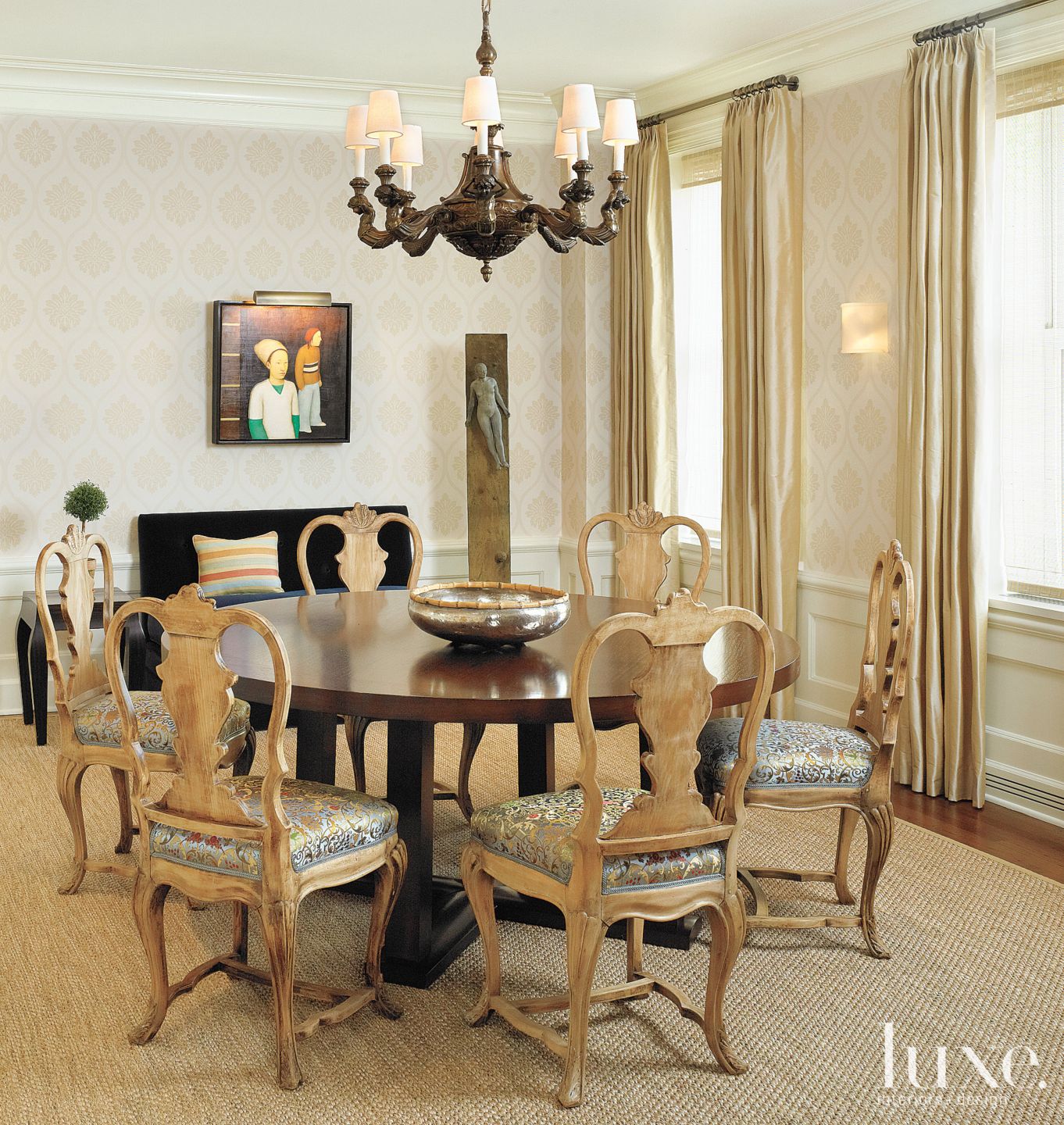Dining room with silk cushioned chairs Luxe Interiors + Design