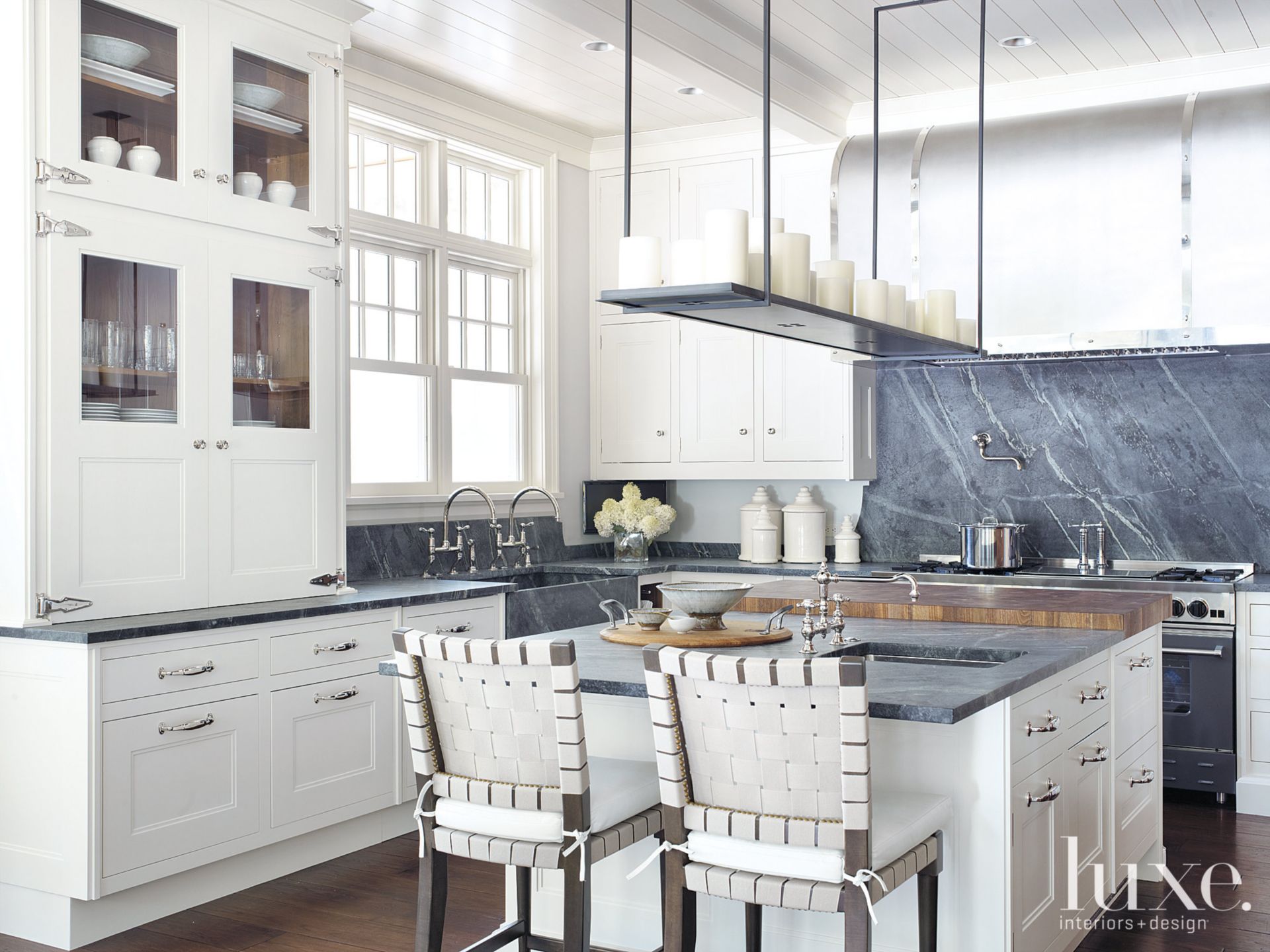 Kitchen with deep bluetoned countertops Luxe Interiors + Design