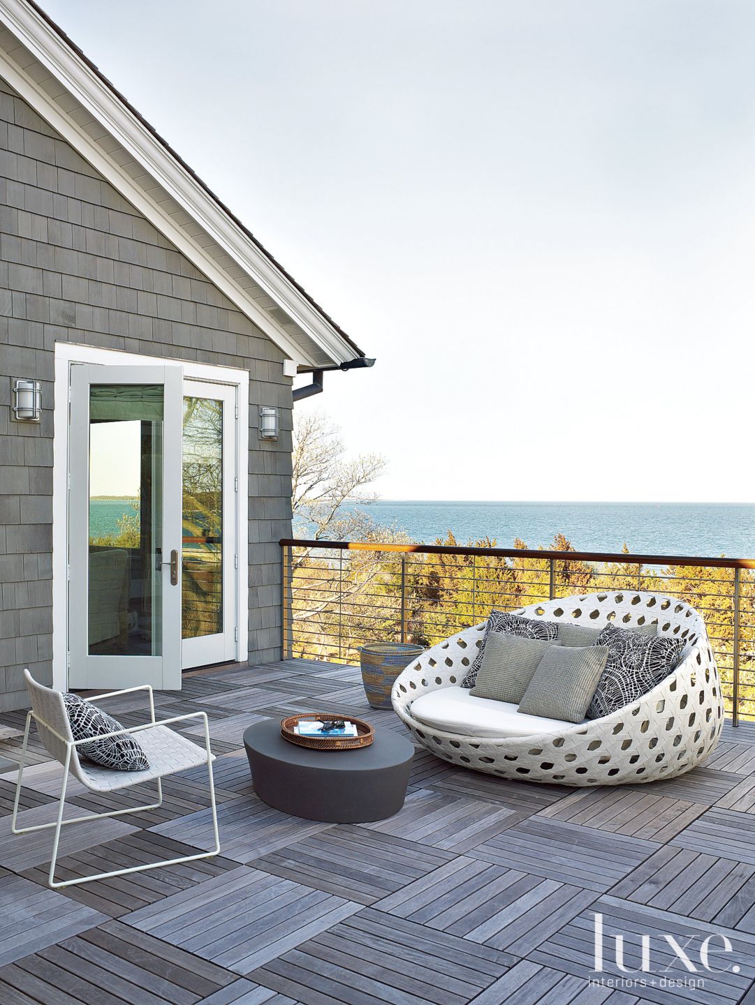 Contemporary Gray Balcony with Lounge Chair Luxe Interiors + Design