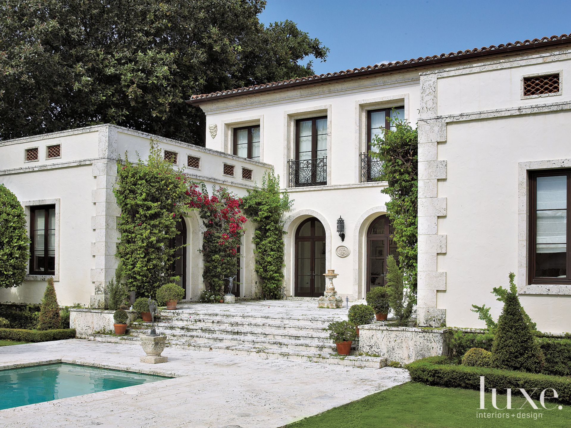 Mediterranean White Exterior with Patio Luxe Interiors + Design
