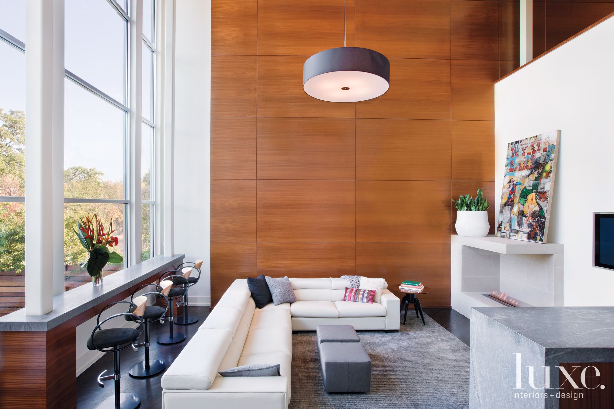Modern White Family Room with Wood Paneled Accent Wall Luxe Interiors