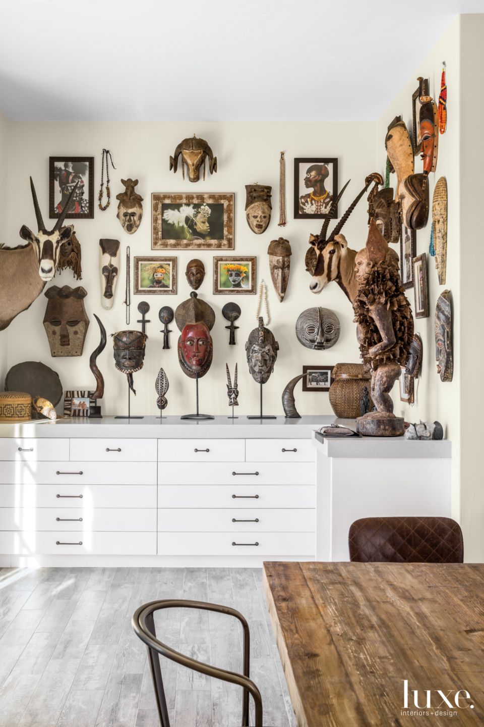Transitional Neutral Studio with Tribal Masks Luxe Interiors + Design