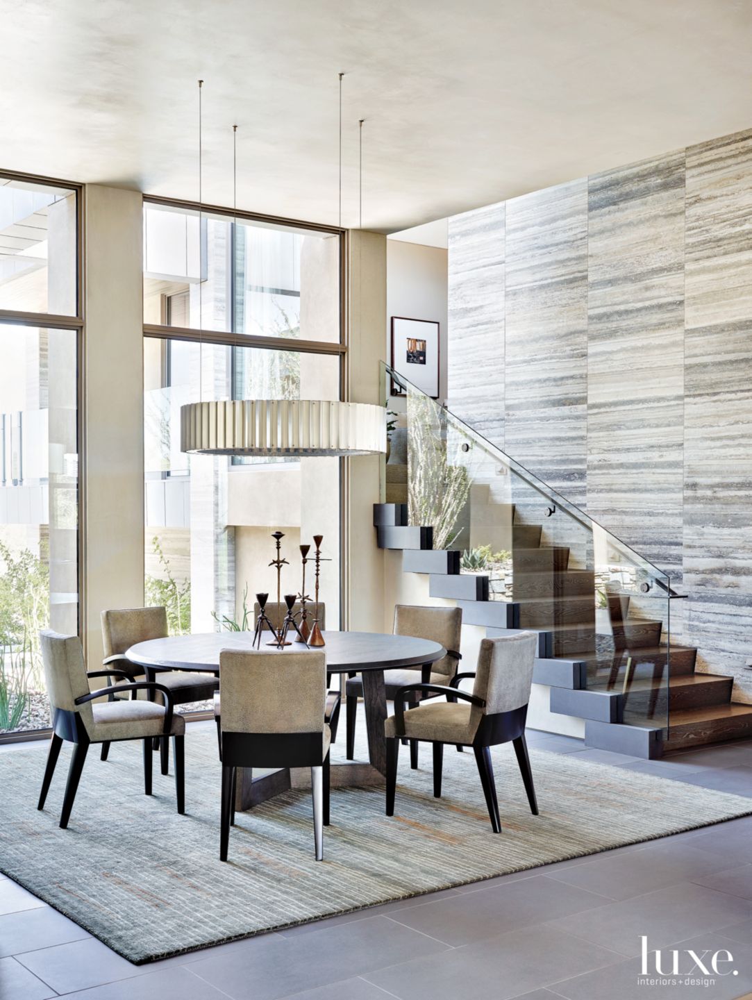 Contemporary Neutral Dining Room with Dynamic Staircase - Luxe ...
