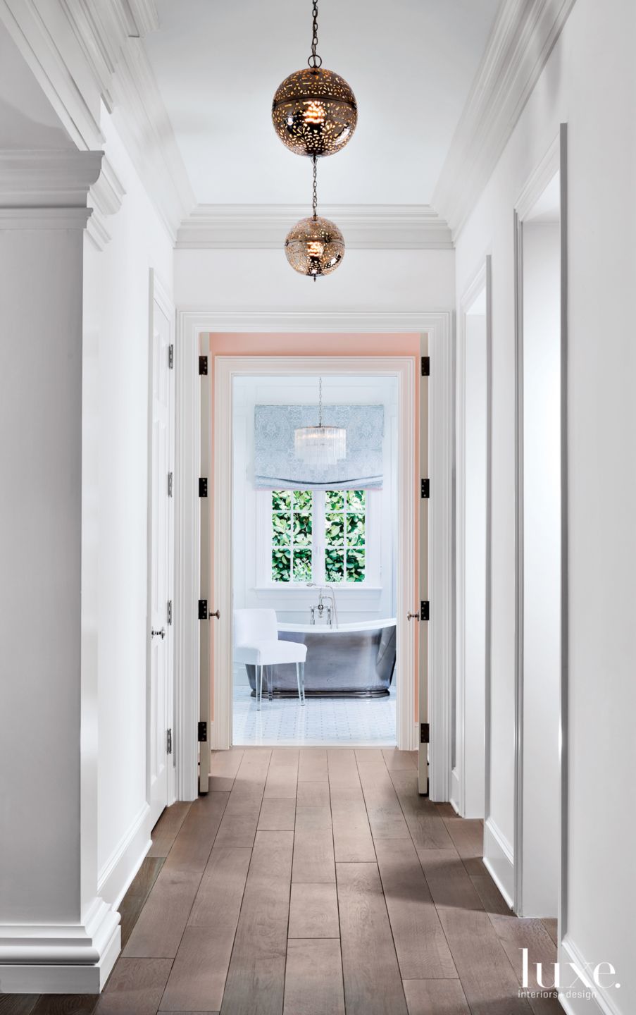Contemporary White Hallway with Round Pendant Lights Luxe Interiors