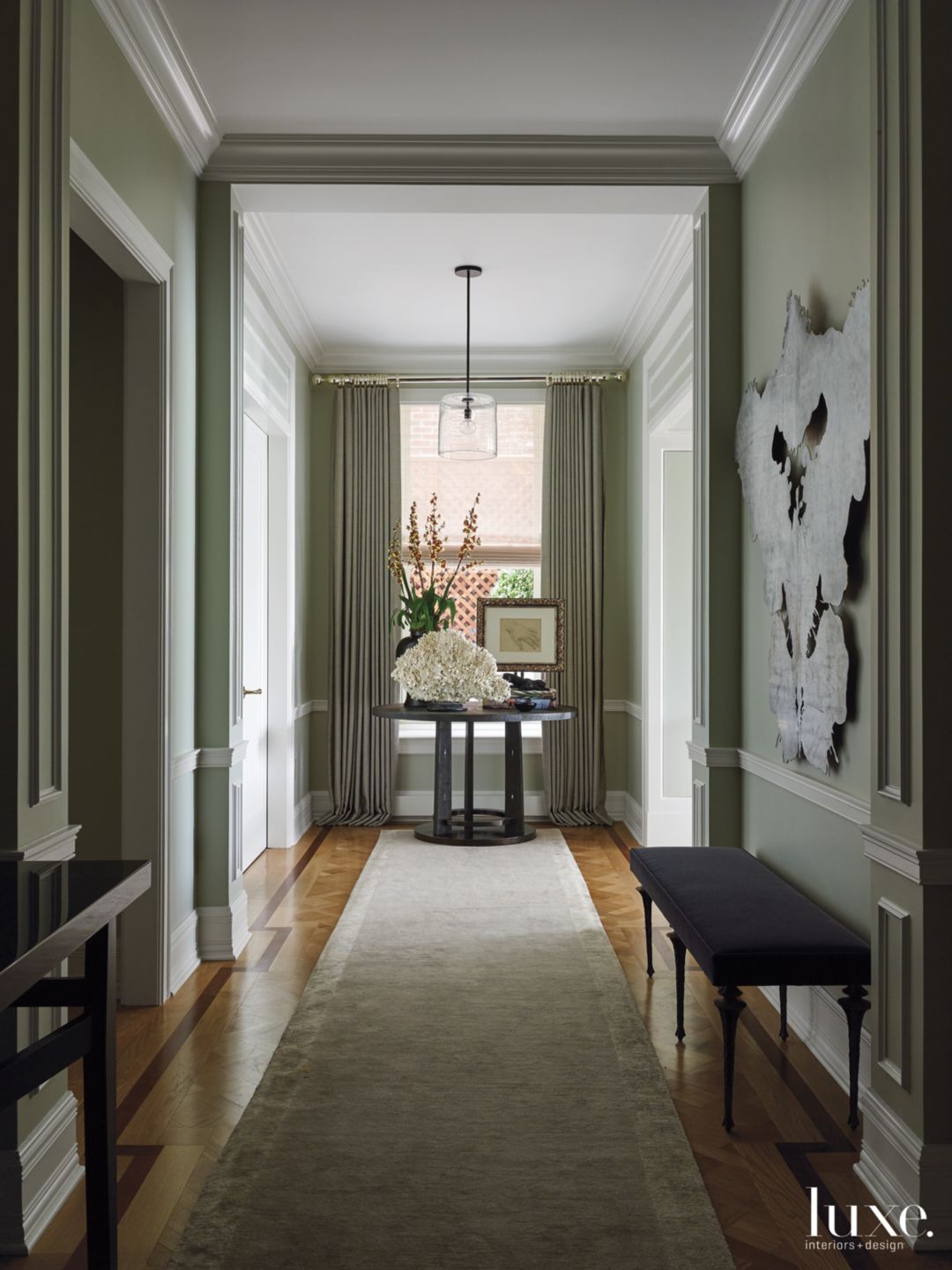 Contemporary Green Hallway with Black Entry Table - Luxe Interiors + Design