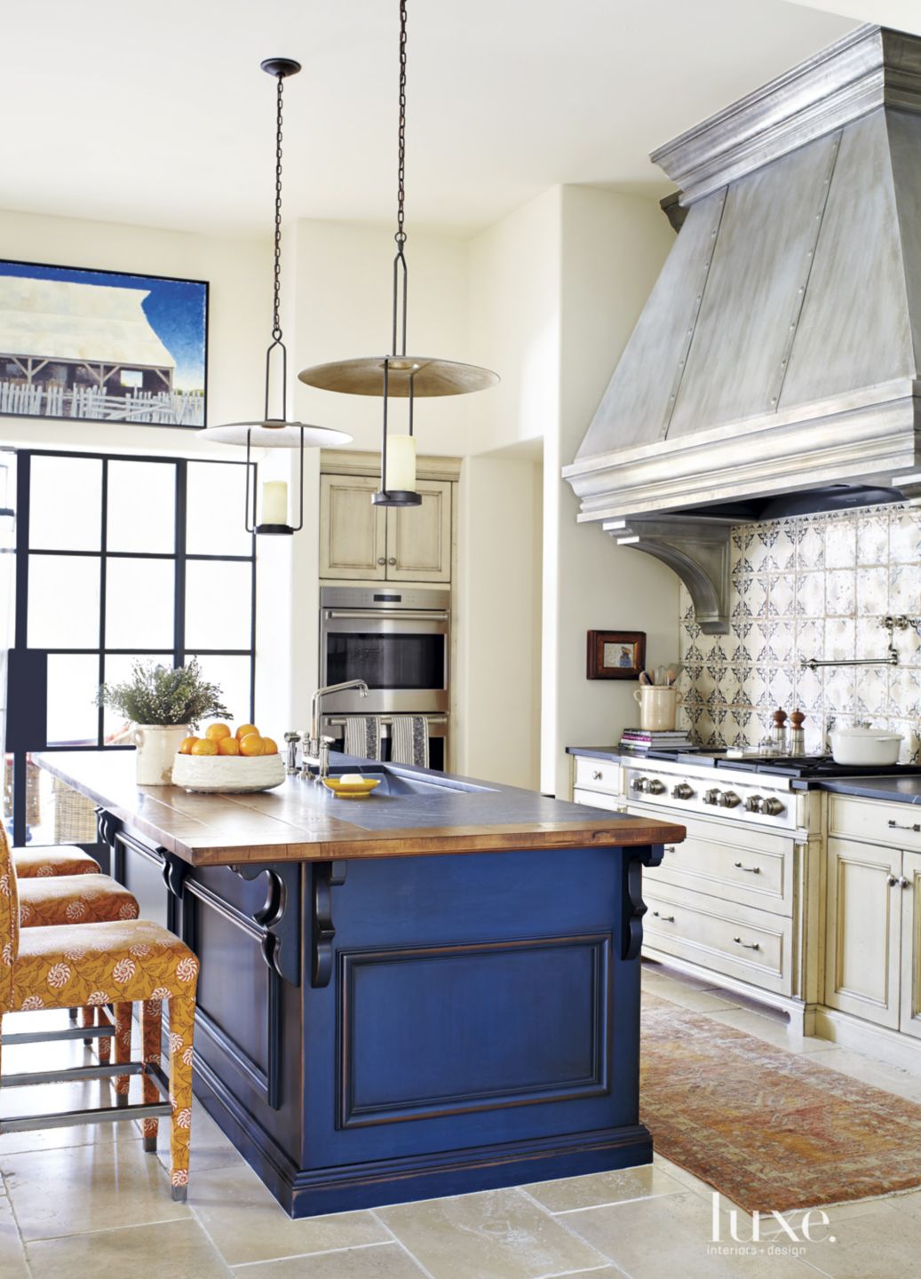 Mediterranean Cream Kitchen with Blue Island Luxe Interiors + Design