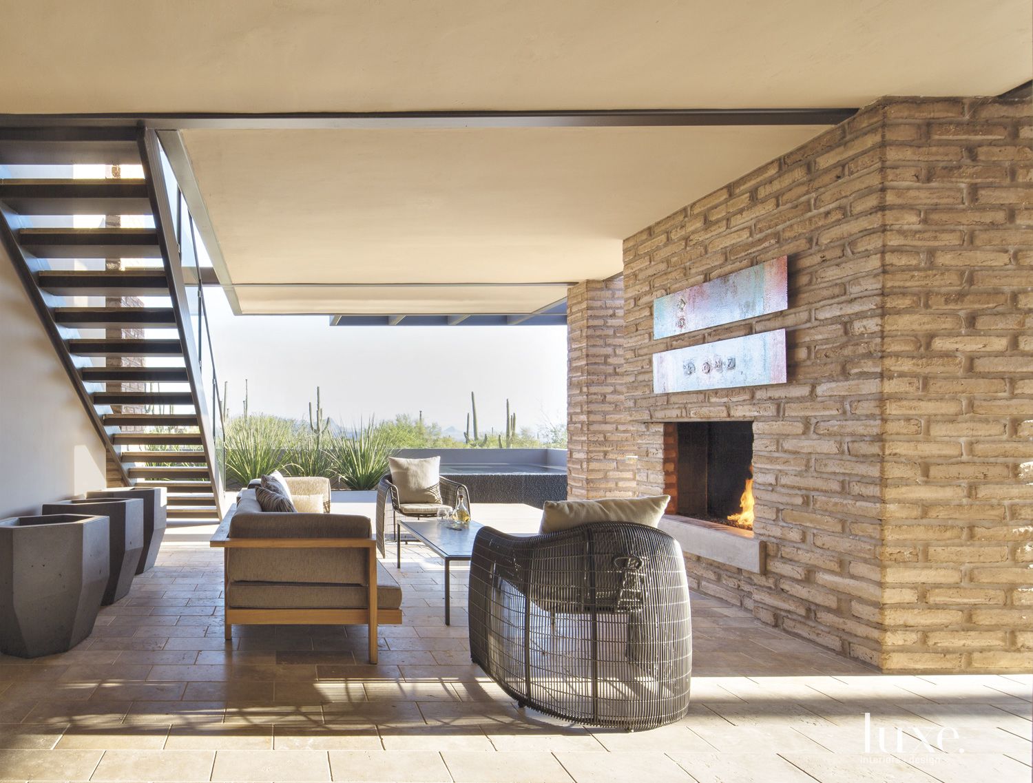 Contemporary Outdoor Living Room with Fireplace - Luxe Interiors + Design
