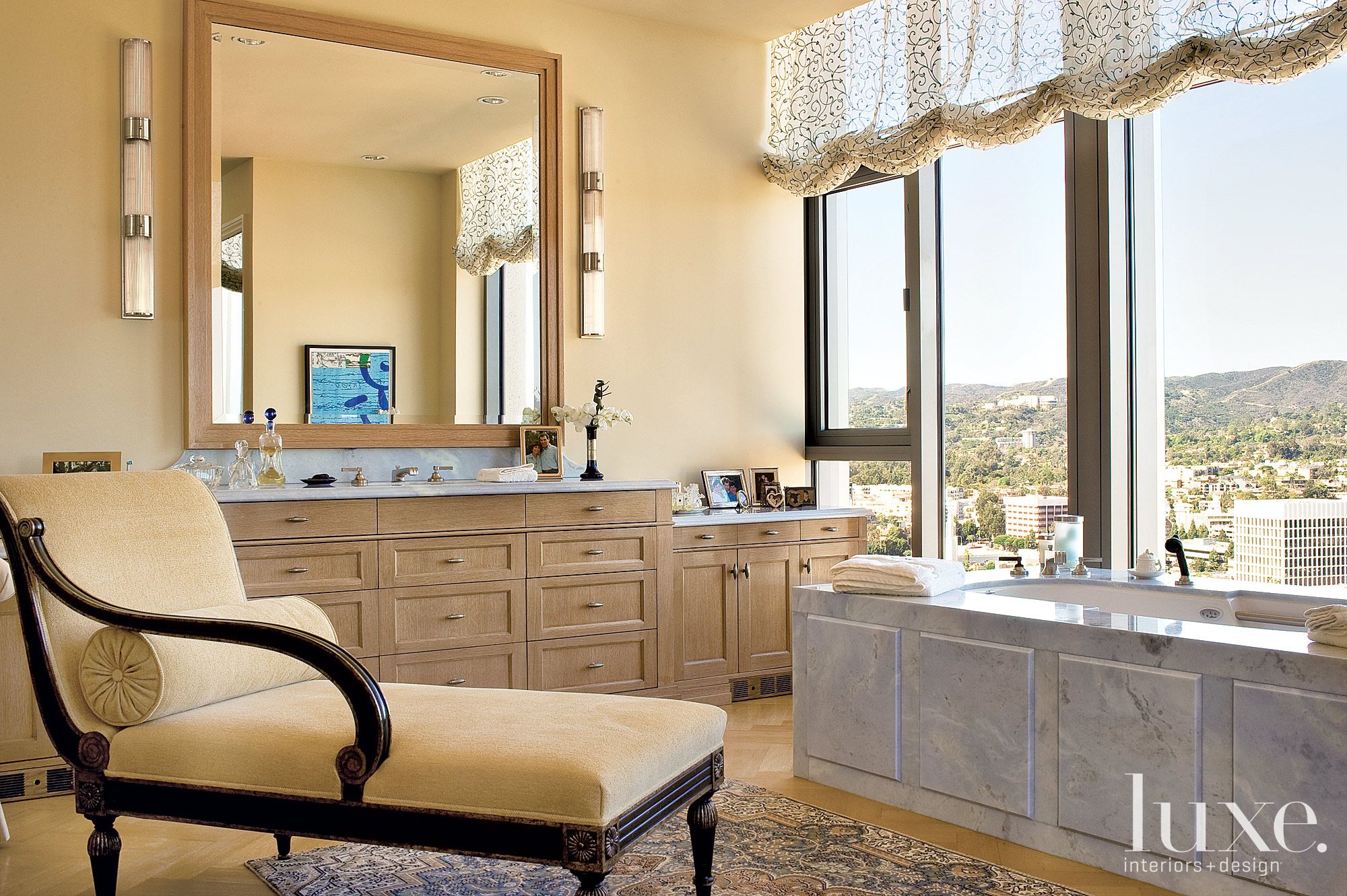 Eclectic Cream Bathroom with Chaise Lounge Chair - Luxe Interiors + Design