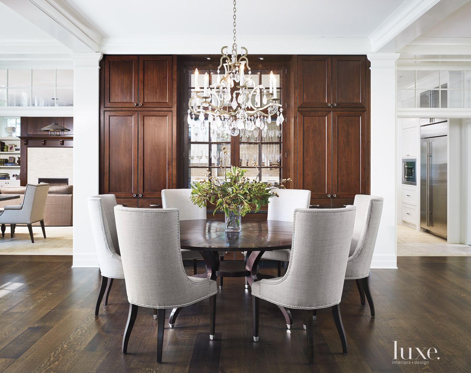 Transitional White Dining Room with Crystal Chandelier | Luxe Interiors