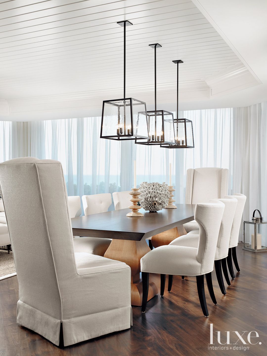 Contemporary White Dining Room with Klismos Chairs