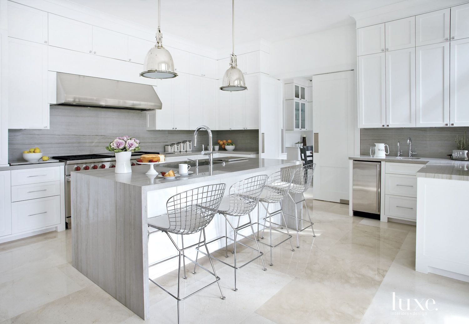 Contemporary White Kitchen with Gray Stone Backsplash and Countertops - Luxe Interiors + Design