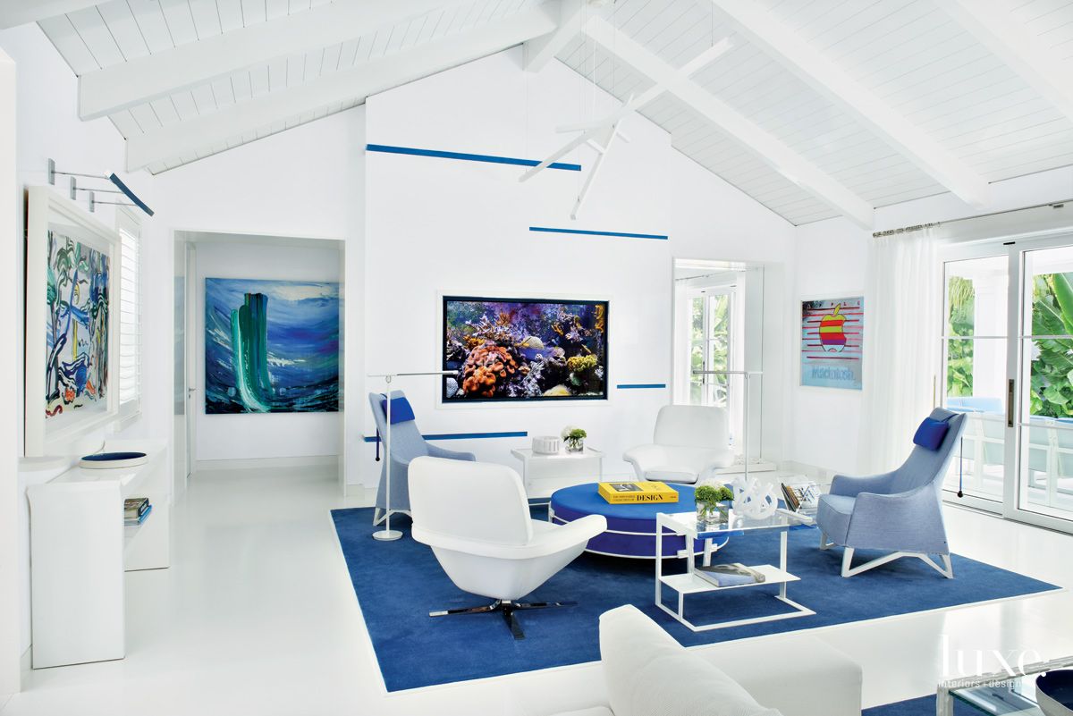 Contemporary White Living Room Seating Area with Swivel Chairs Luxe