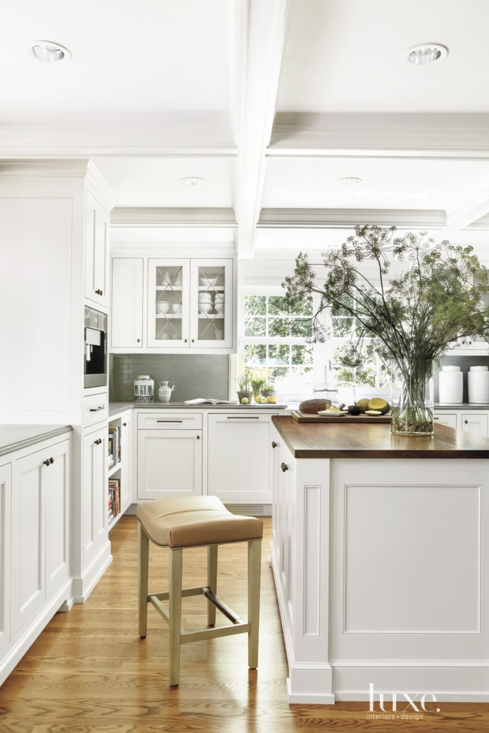 Traditional White Kitchen with Hidden Appliances | Luxe Interiors + Design