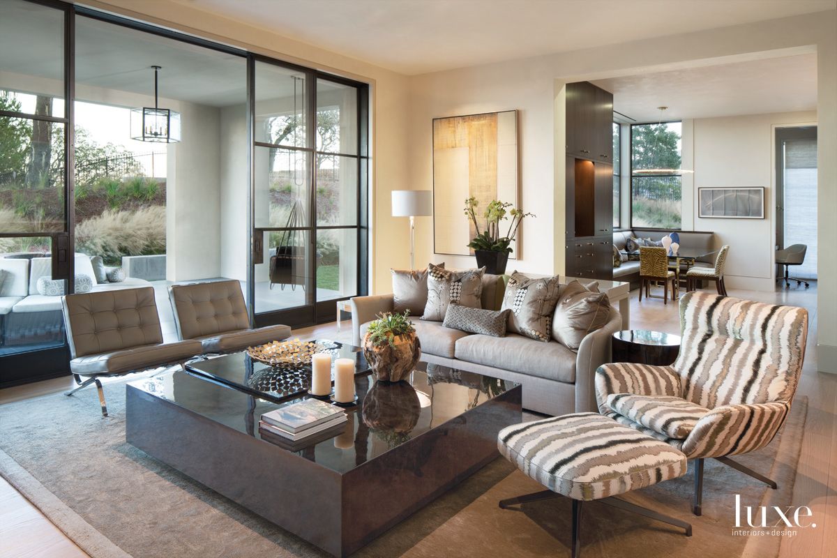 Modern Neutral Family Room with Striped Bergère Chair - Luxe Interiors ...