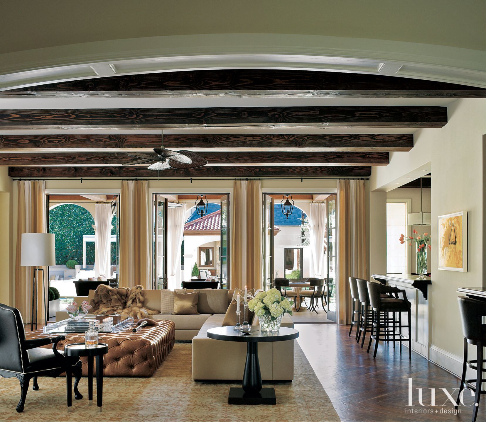 Traditional Living Room with Exposed Beams - Luxe Interiors + Design