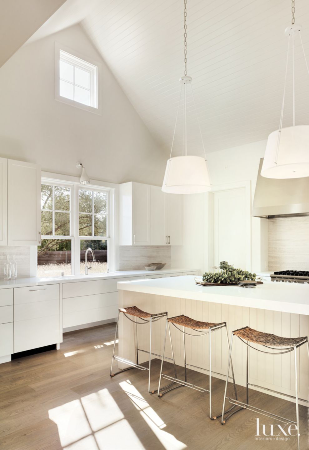 Contemporary White Kitchen with Vaulted Ceiling - Luxe Interiors + Design