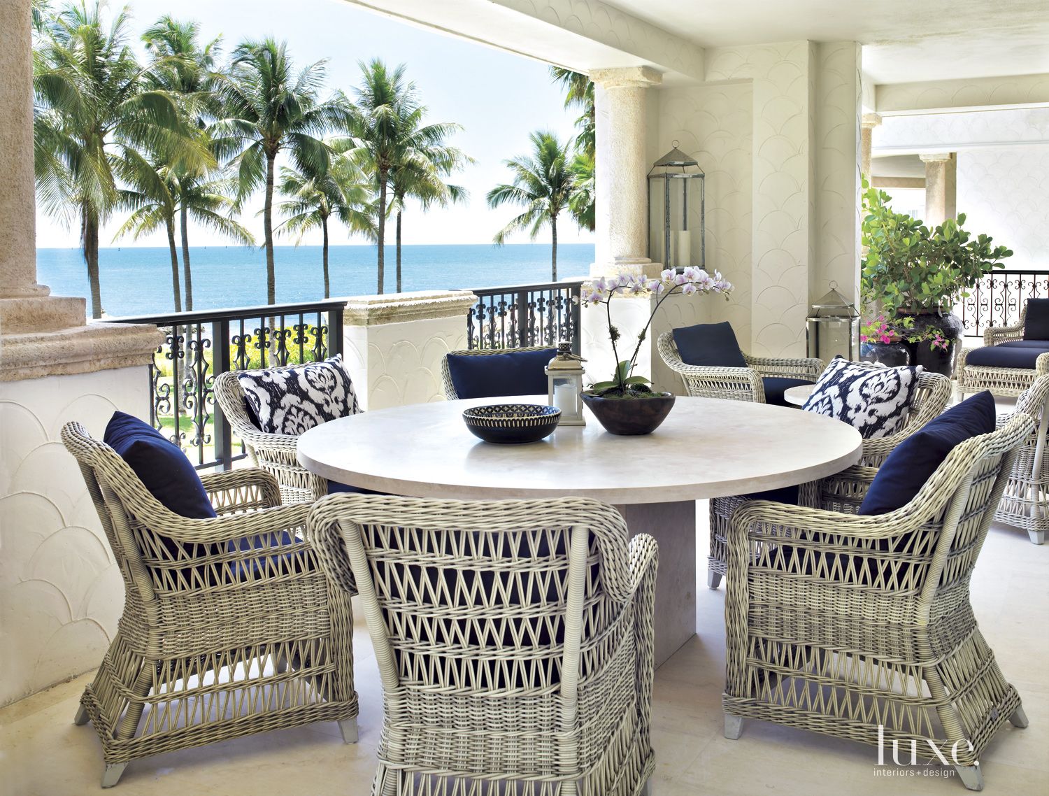 Modern Neutral Veranda with Round Table - Luxe Interiors + Design